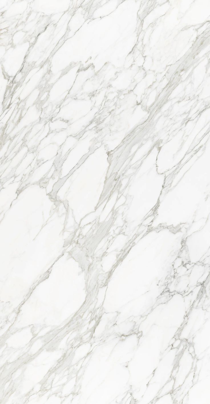 a white marble textured surface with black accents