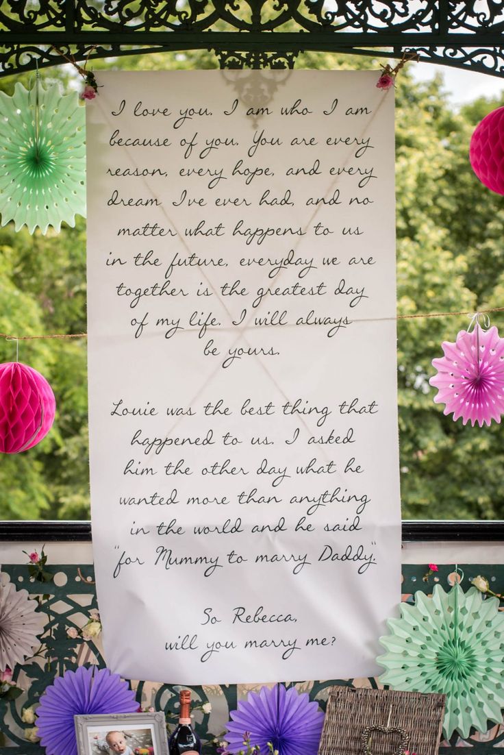 a letter written to someone in front of some paper fans and other decorations on the wall