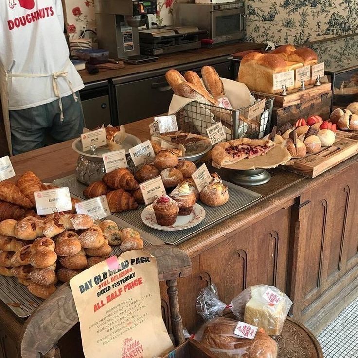 breads and pastries on display in a bakery