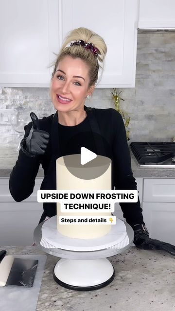 a woman sitting in front of a cake with the words upside down frosting technique