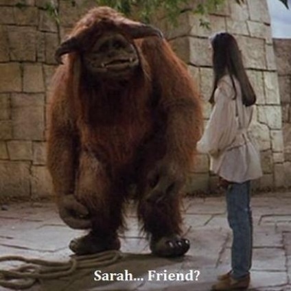 a woman standing next to a giant stuffed animal