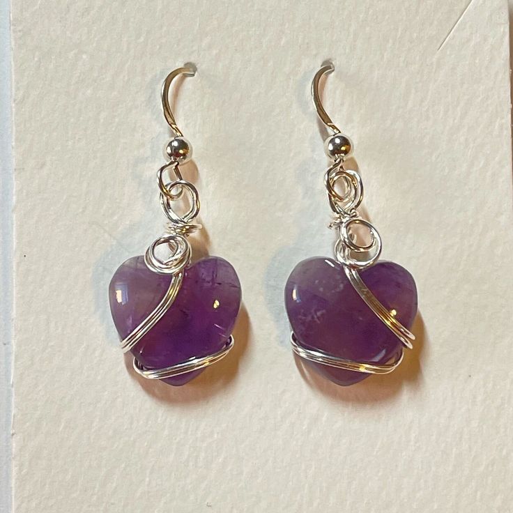 These delicate amethyst heart earrings are the perfect gift for Valentine's or Mother's Day, or just to show someone how much you care. Amethyst is also the February birthstone. The earrings come with two pairs of rubber ear backs. You have a choice in packaging: red heart pouch tucked in a gift box tied with a heart-studded ribbon OR silver star pouch in a gift box tied with a silver ribbon. These are natural stones so each pair of earrings may vary slightly in their color and opacity.  I also make amethyst heart pendants. If you order both the earrings and pendant I will do my best to match up the color. Heart Cut Amethyst Jewelry For Gifts, Heart Cut Jewelry With Matching Earrings For Gifts, Nickel-free Heart Pendant Earrings For Gift, Purple Double Heart Jewelry For Valentine's Day, Valentine's Day Amethyst Jewelry Gift, Nickel Free Heart Earrings, Nickel-free Heart Earrings For Her, Nickel-free Adjustable Heart Earrings, Nickel-free Heart Earrings