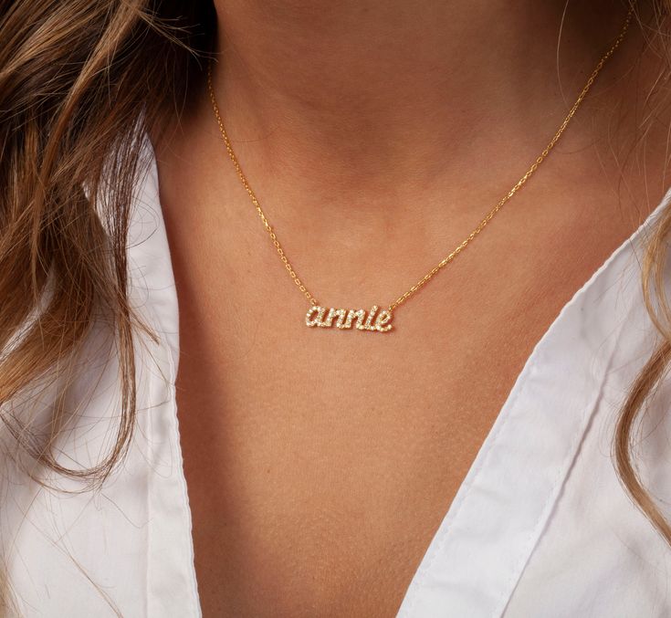 This 14k personalized diamond name necklace is the perfect gift for the bridal party, someone special, or yourself.__________________________________________M A T E R I A L & L E N G T HAvailable in 14k Yellow Gold, 14k Rose Gold, 14k White Gold, Sterling SilverStone: Natural DiamondsThickness: 1.2mm / 0.05"InitialsLowercase: 5 mmCapital: 9 mmDiamond: 0.15 ct. - 0.40 ct. depending on the name Chain length: 14+2, 16+2, 18+2 options or ant length up to 20 inches without extension. Please leave a n Customizable Gold Name Necklace For Wedding, Personalized Gold Name Necklace For Wedding, 14k Gold White Name Necklace For Anniversary, Customizable Dainty 14k Gold Name Necklace, White 14k Gold Name Necklace For Anniversary, Classic Name Necklace For Mother's Day Anniversary, Anniversary 14k Gold White Name Necklace, Dainty Rose Gold Name Necklace For Wedding, Customizable Rose Gold Name Necklace For Wedding