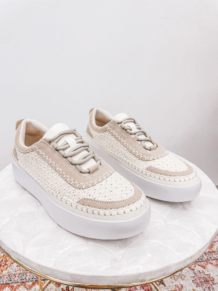 Step out in style with The Shauna Woven Sneakers. These taupe and cream lace up sneakers are the perfect choice for a trendy street style look. The woven design adds a unique touch to these casual yet chic shoes. Stand out from the crowd and make a statement with these playful and sneakers. True to size Beige Low-top Sneakers With Perforations, Beige High-top Sneakers With Perforations, Casual Beige High-top Lace-up Shoes, Beige High-top Sneakers With Perforated Toe Box, Off White Low-top Sneakers With Laces, Sporty Cream Sneakers With Flat Heel, Sporty Cream Sneakers, White Lace-up Shoes With Textured Sole And Flat Heel, White Lace-up Shoes With Textured Sole