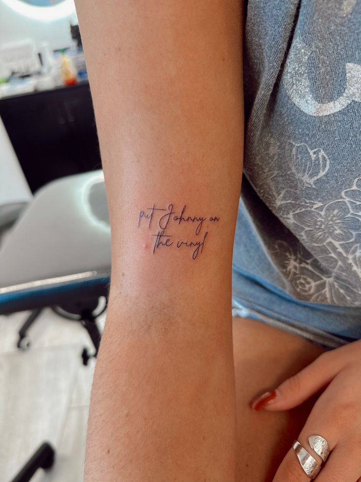 a woman with a tattoo on her arm that says, not today is the day