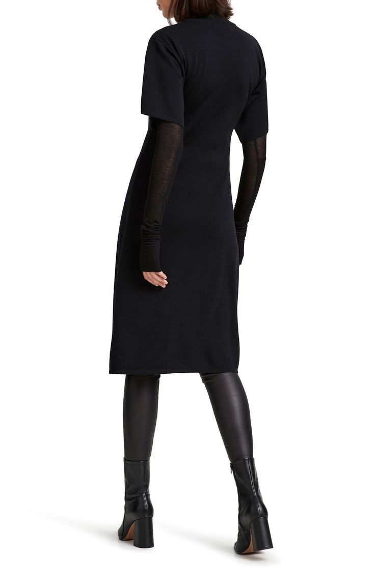 This ultrachic tunic is crafted from fine merino wool and makes a striking silhouette whether worn solo or as part of your modern layered look. Slips on over head Jewel neck Short sleeves High-low hem 100% merino wool Imported Elegant Fall Dresses For Layering, Elegant Dresses For Fall Layering, Knit Dresses For Layering, Chic Fitted Sweater Dress For Layering, Fitted Black Sweater Dress For Layering, Black Fitted Sweater Dress For Layering, Chic Fitted Cashmere Dress, Chic Cashmere Fall Dress, Chic Cashmere Sweater Dress For Work