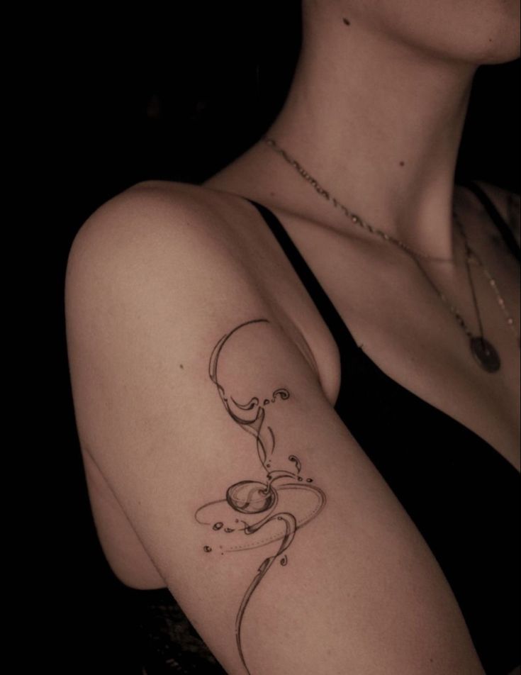 a woman with a tattoo on her arm