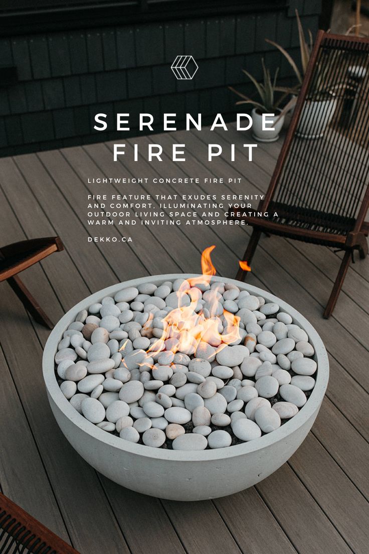 a fire pit sitting on top of a wooden deck