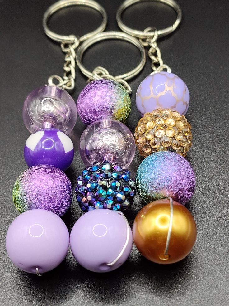 a bunch of different colored balls on a keychain