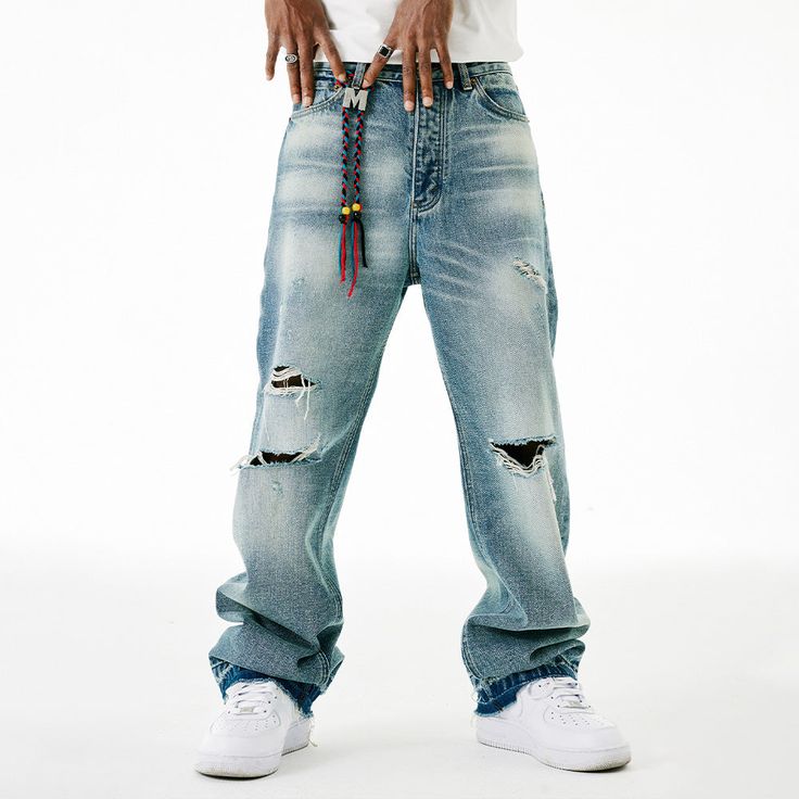 Unlock edgy and effortless style with our M ripped jeans. Made with high-quality denim, these jeans are designed to be both durable and fashionable. The distressed detailing adds a touch of edginess to your look, making them perfect for any occasion. Elevate your wardrobe with these premium jeans that exude sophistication and exclusivity. Features: -45% Cotton, 55% Polyester -Mid-Waist -Premium Denim Fabric -Regular fit -Street style