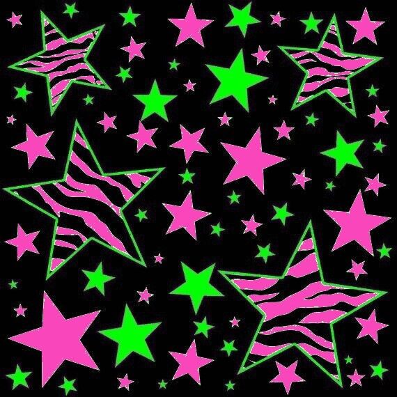 pink and green stars against a black background