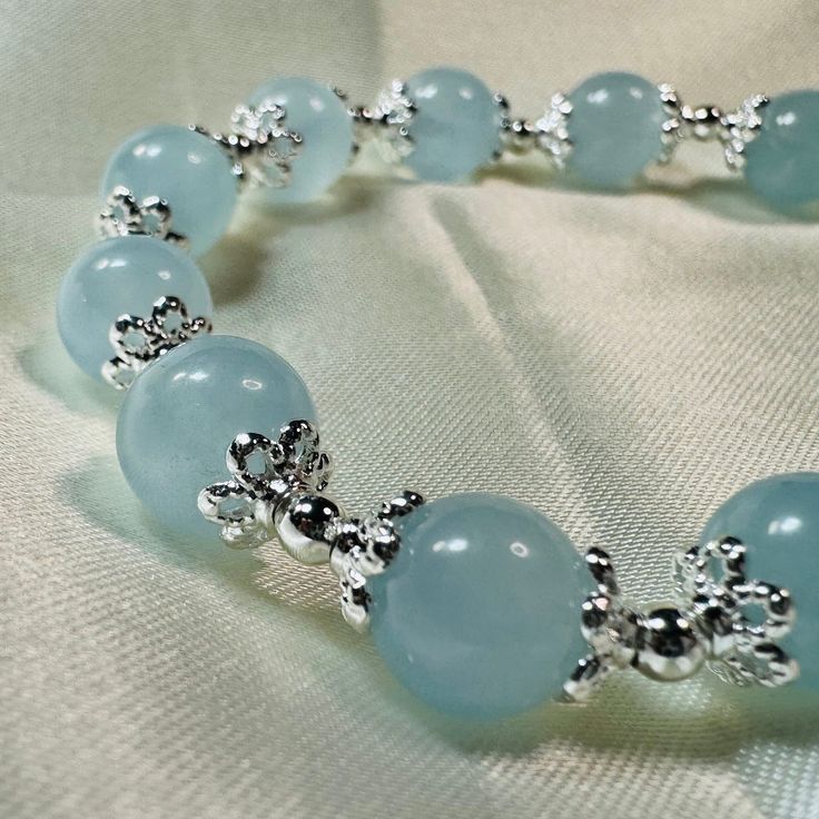 Aquamarine Bracelet, March Birthstone Crystal Bracelet Gemstone Bracelet Stretch Bracelet Free standard domestic shipping (Australia) for orders over $49.95 AUD. Free standard shipping when you buy two or more items (Domestic and international buyers). This bracelet is made with 8.5mm aquamarine. Bracelet is double corded with high quality elastic cord for durability. Default size of this bracelet is 18cm (7 inch). Bracelet can be made smaller if required (but not larger due to limited material) Crystal Stone Bracelet Ideas, Blue Crystal Bracelet With Stones As A Gift, Blue Crystal Bracelet With Stones For Gift, Blue Crystal Bracelet Gift, Adjustable Aquamarine Silver Bracelet, Adjustable Silver Aquamarine Bracelets, Adjustable Silver Aquamarine Bracelet, Aquamarine Natural Stone Bracelets For Gifts, Elegant Aquamarine Bracelets With Natural Stones