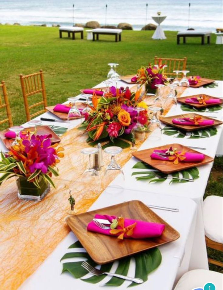 a long table with plates and place settings on it