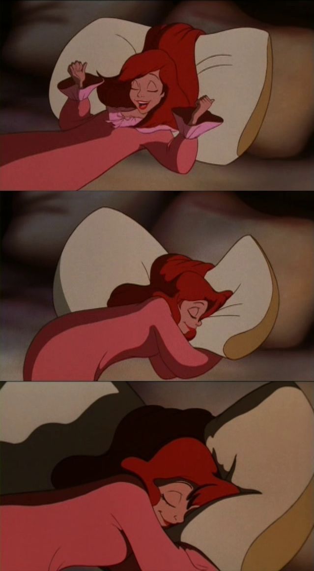 the little mermaid is laying in bed with her head down and looking at something off to the side