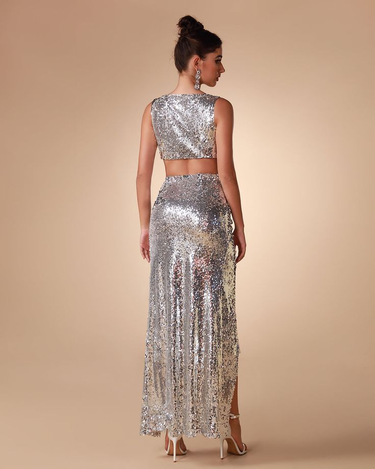 Unleash your inner diva with our Argent Sequin Two Piece Set. Featuring a glittery and glamorous sequin fabric, this two piece ensemble is perfect for making any night out extra special. Cut in a sleek silhouette, it's designed to flatter every figure and bring out your best look. Our Style No.KLYF823 Bead Piece Height - 68.9"/175cm Bust - 34.6"/88cm Waist - 25.6"/65cm Hips - 36.6"/93cm and wears size S About Wholesale/Dropshipping, please contact us! Note: Colour may vary due to lighting on ima Glamorous Embellished Sequin Fabric For Prom, Glamorous Embellished Sequin Fabric For Night Out, Festive Evening Sequin Dress With Shimmer, Glamorous Festive Sequin Dress For Night Out, Glamorous Sequin Dress For Festive Evenings, Glamorous Evening Sequin Dress For Festive Occasions, Glamorous Sequin Fabric For Evening Prom, Glamorous Sparkling Sequin Fabric For Gala, Glamorous Festive Evening Sequin Dress