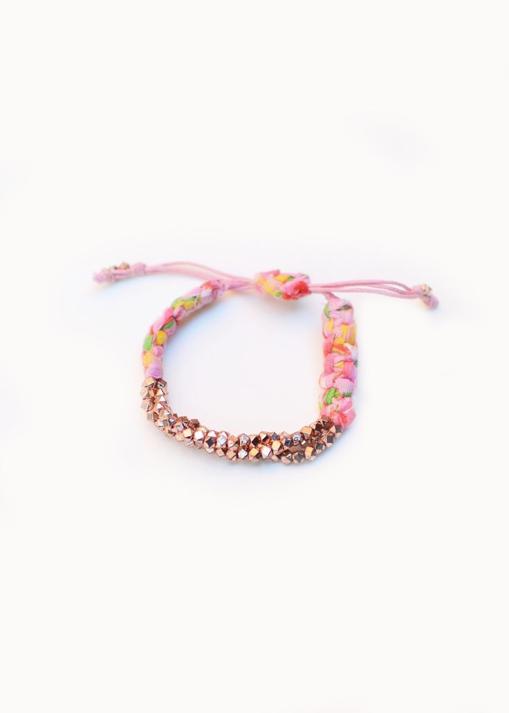 "Rose Gold Cluster Nugget Bracelets are handmade in New York City with Pink Bandana. Prasada in Sanskrit means \" God's blessing\". Nugget is a symbol of good fortune. Prasada bracelet is a nice gift with a great intention for yourself and your beloved. Meanwhile, it adds a romantic bohemian touch to your wrist to complete a casual chic look. The length of the bracelet is adjustable." Pink Resizable Friendship Bracelets For Festival, Pink Spiritual Bracelets Hand Wrapped, Pink Spiritual Hand Wrapped Bracelets, Pink Resizable Beaded Bracelets For Festival, Pink Braided Bracelets With Colorful Beads For Festival, Pink Braided Bracelet With Colorful Beads For Festival, Adjustable Pink Braided Bracelet With Colorful Beads, Pink Hand Wrapped Bangle Bracelet, Pink Hand Wrapped Friendship Bracelets For Festivals