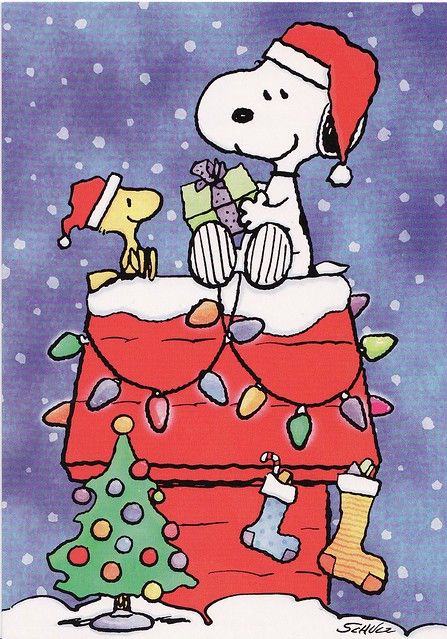 a cartoon dog sitting on top of a christmas tree