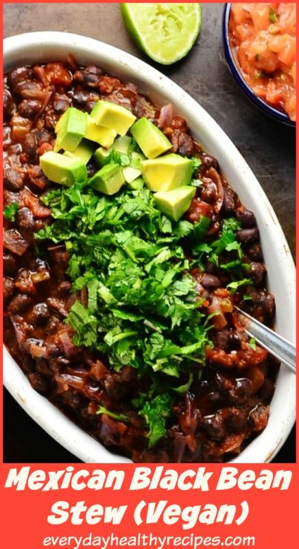 mexican black bean stew with avocado and cilantro in a white bowl