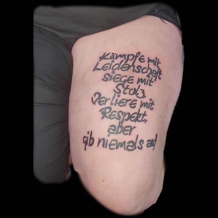 the back of a person's arm with writing on it and words written in black ink