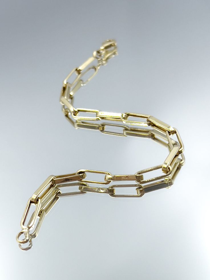 14k Paper Clip Bracelet is made of solid gold. Indispensable jewelry for special occasions such as Bridesmaids, Weddings, Anniversaries, and birthdays.  ✪ Handmade / Handcrafted Fine Jewelry  ✪ Gold Weight: Approx.3.06-5.50 g   ✪ Metal:  14K Solid Gold   ✪Width of each Bangles:   ✪ Length of the each Bangles: 4-10 inches   ✪ Gold Color: White gold, Rose gold, Yellow gold ♡ For questions or special designs, please contact us via message. We are happy to hear from our customers and always respond 14k Gold Link Bracelet Gift, Classic Paperclip Bracelet With Rectangular Solid Links, 14k Gold Bracelet With Solid Link As A Gift, 14k Gold Link Bracelet As Gift, Classic Oblong Jewelry With Polished Finish, 14k Gold Oval Link Bracelet For Anniversary, Classic Oval Paperclip Bracelet For Gift, Classic Rectangular Paperclip Bracelet For Formal Occasions, Classic Rectangular Paperclip Bracelet