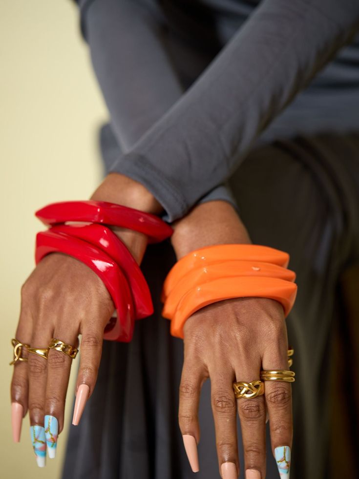 Introducing our vibrant and spirited collection of Colorful Bangles, a celebration of individuality and joyous self-expression. Crafted with meticulous attention to detail, these bangles are a kaleidoscope of hues, designed to complement any outfit and uplift your mood instantly. Each piece in this collection boasts a riot of colors, from bold and vibrant tones to subtle pastels, ensuring there's a bangle for every style and personality. Whether you prefer stacking them for a playful bohemian look or wearing a single statement piece, our Colorful Bangles effortlessly add a pop of color to your ensemble. Dive into a world of vivacity and flair – explore the endless possibilities our Colorful Bangles bring to your accessory collection. Bangles are sold as a set of three Product is non-return Acrylic Bangles, Blouse Drawing, Bright Accessories, Dope Jewelry Accessories, Colorful Bangles, Figure Flattering Dresses, Dope Jewelry, Bohemian Look, Jewelry Fashion Trends