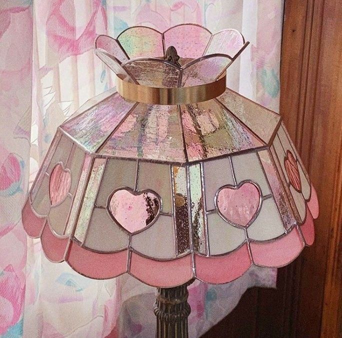 a stained glass lamp with hearts on it