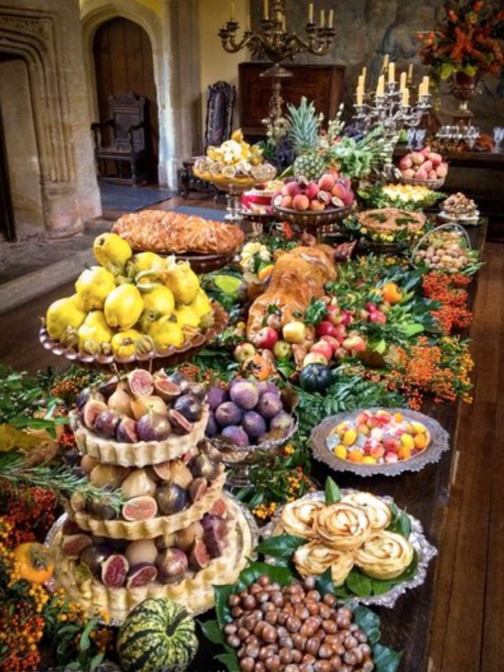 a long table filled with lots of different types of food on it's sides