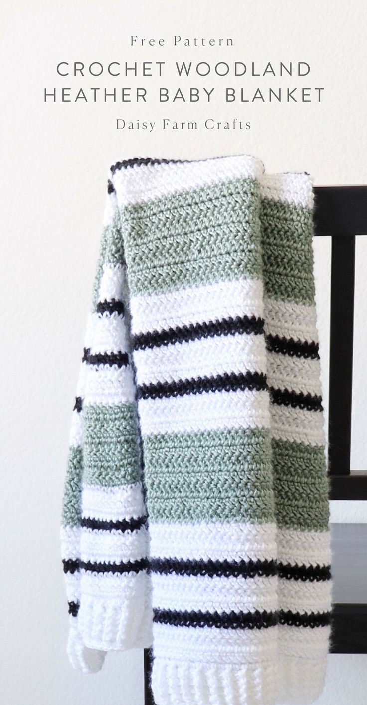 a green and white striped blanket sitting on top of a chair