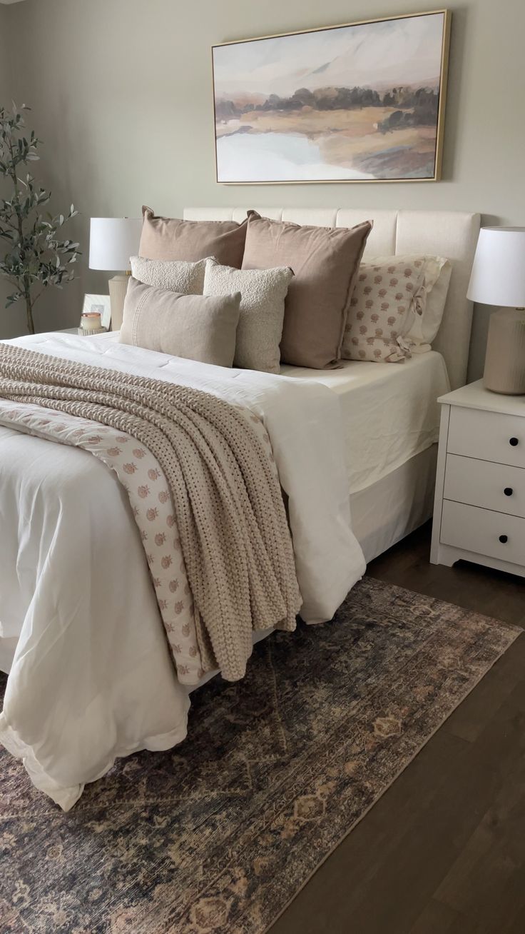 a large bed sitting in a bedroom on top of a wooden floor