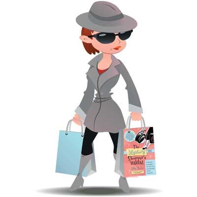 a woman carrying shopping bags in her hand and wearing a gray coat, hat and sunglasses