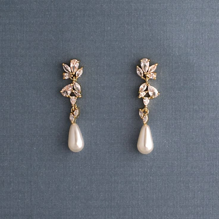 A single ivory teardrop pearl hangs from a delicate cluster of CZ jewels. These wedding day earrings are delightfully elegant. They are about 1.25 inches long and .25 inches wide, lead and nickel free, grade AAA CZ stones. Nose Piercing Gold, Aesthetic Silver Jewelry, Wedding Day Earrings, Jewelry Lookbook, Cz Earrings, Girly Jewelry, Dream Jewelry, Stylish Jewelry, Dainty Jewelry