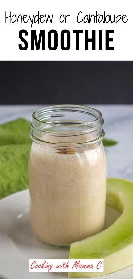 a smoothie in a mason jar with an avocado on the side