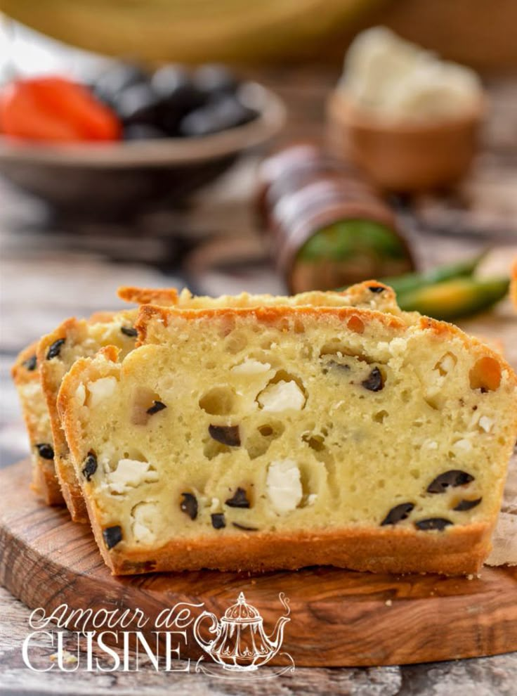 slices of bread with raisins and cheese on a cutting board next to other food items