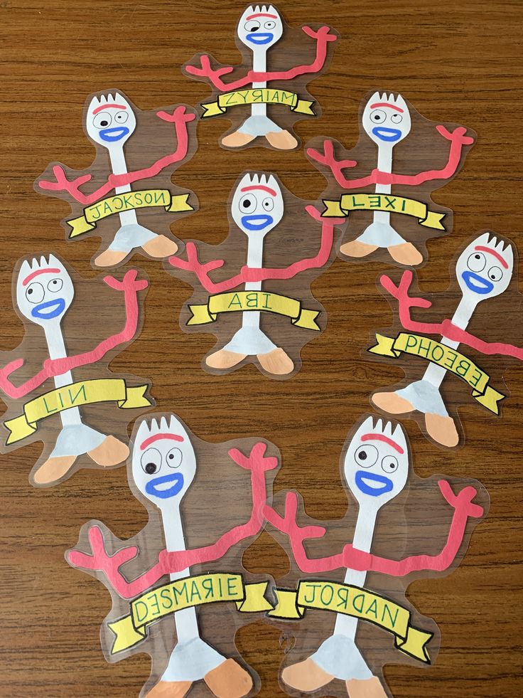 a group of stickers with different faces and arms in the shape of spoons