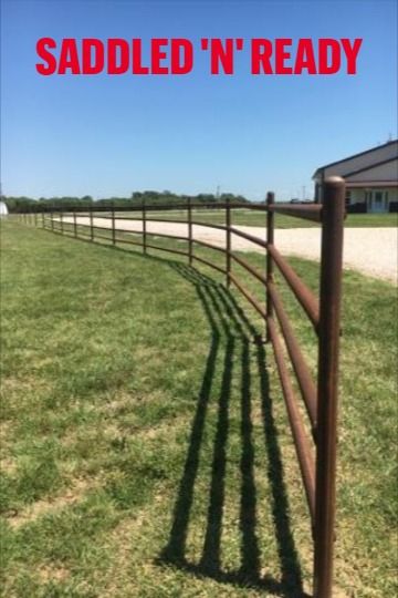 a fence with the words saddled'n ready on it