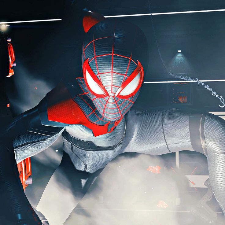 a spider - man in a futuristic suit with red eyes