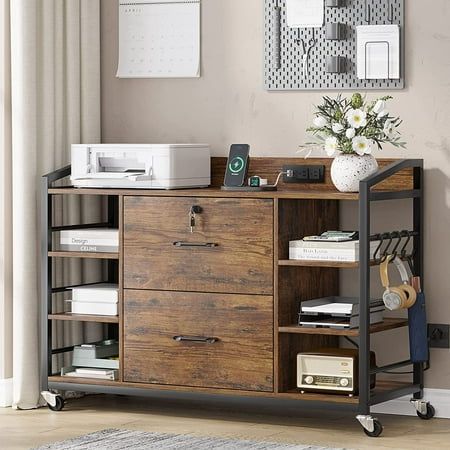 a wooden cabinet with drawers and shelves in front of a white flower vase on top of it