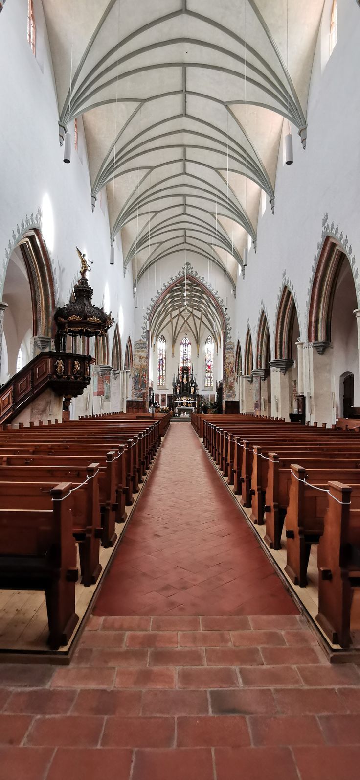 the inside of a church with rows of pews