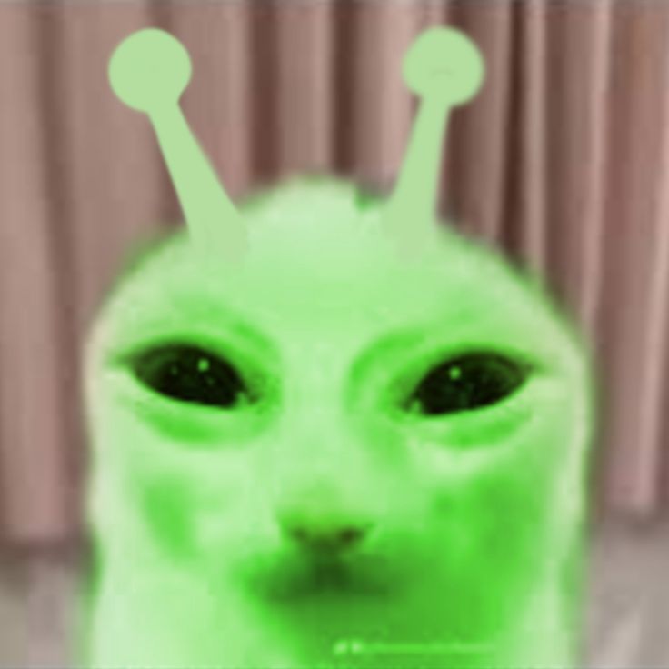 an alien like creature with green eyes and antennae