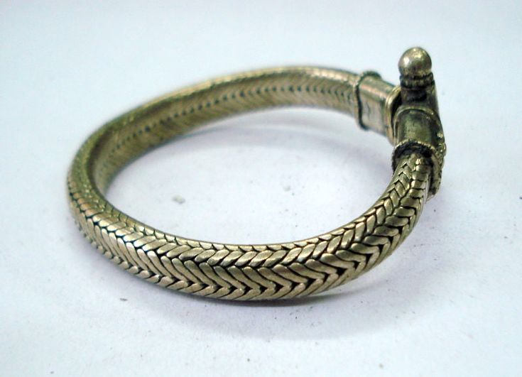 VINTAGE SILVER ROPE CHAIN BRACELET FROM RAJASTHAN INDIA, GREAT HANDMADE SNAKE DESIGN BRACELET, GOOD FOR JEWELLERY COLLECTION. Note - Please check pictures care fully for more detail. length - 19.4 cm(7.6 inch) we can adjust the length. width - 9 mm weight - 75 grams material - silver. Traditional Snake Shape Jewelry Gift, Handmade Antique Sterling Silver Bracelet, Handmade Antique Sterling Silver Bracelet As Gift, Antique Handmade Adjustable Sterling Silver Bracelet, Handmade Antique Silver Bracelet For Ceremonial Use, Handmade Antique Silver Bracelet For Ceremonial Occasion, Handmade Antique Silver Bracelet For Ceremonial Events, Handmade Sterling Silver Bracelet For Ceremonial Festivals, Handmade Traditional Sterling Silver Bracelet For Festivals