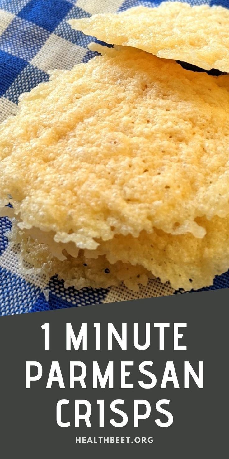 two pieces of parmesan bread on a blue and white checkered table cloth