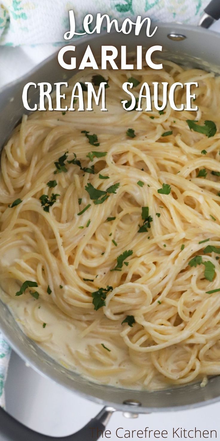 lemon garlic cream sauce in a skillet with parsley on top and text overlay that reads, lemon garlic cream sauce