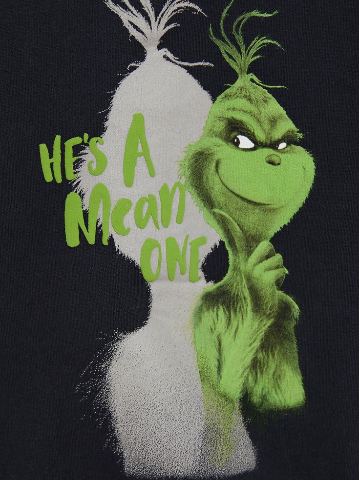 an image of the grin face on a t - shirt that says he's a mean one