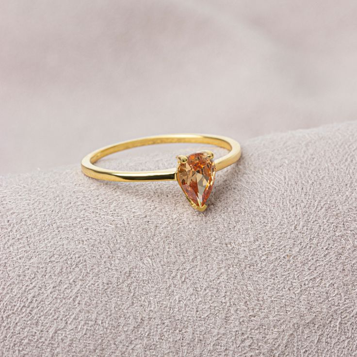 Citrine stone will envelop one's soul with joy and happiness. It is believed that citrine stone, which helps to reduce intense stress and get rid of tension, attracts abundance. While shaping our ring, we were impressed by the beauty of the rain and gave it a drop shape. This drop-shaped citrine ring will give you happiness. It is stylish and suitable for daily use. We are sure that our ring will add style to your style. The birthstone for those born in November is Citrine. Our necklace compatib Yellow Gold Topaz Crystal Ring As Gift, Citrine Birthstone Ring With Prong Setting As Gift, Yellow Gold Topaz Birthstone Ring For Gift, Yellow Gold Topaz Birthstone Ring As Gift, Fine Jewelry Teardrop Crystal Ring As Gift, Yellow Gold Citrine Crystal Ring Gift, Teardrop Crystal Ring Fine Jewelry Gift, Gold Topaz Birthstone Ring Gift, Gold Pear-shaped Topaz Gemstone Ring