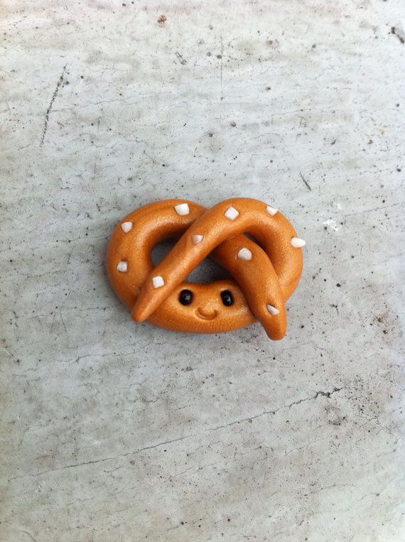 a fake pretzel with white polka dots on it's face and the caption says, soft pretzel