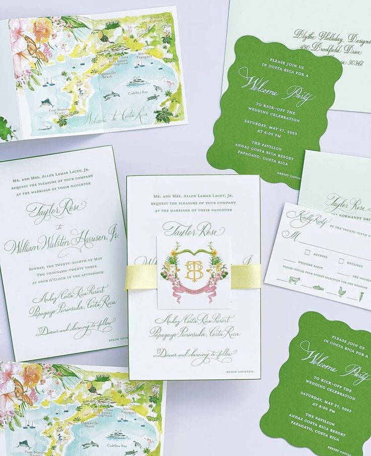 the wedding stationery is laid out on top of each other