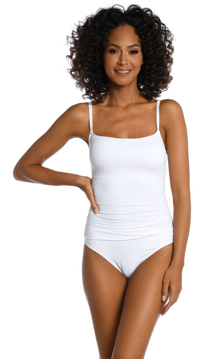 Sunbathe seaside in this lingerie one-piece swimsuit by La Blanca. The delicate and simple lingerie shape exudes a simple, feminine style. Adjustable straps and removable cups allow this piece to fit to you. Slimming fabric finishes the smooth, delicate look. Moderate rear coverage. [split] Details One piece swimsuit Shirred side seams Removable cups Adjustable straps Fabric 83% Nylon, 17% Elastane Beach Bodysuit With Stretch And Wide Straps, Stretch Bodysuit With Wide Straps For Beach, White Beach Camisole With Built-in Bra, Elegant White Swimwear With Adjustable Straps, Summer Bra Friendly Camisole Swimwear, Fitted Camisole Swimwear With Straps, Seamless Camisole Swimwear In Solid Color, Solid Camisole Seamless Swimwear, Solid Seamless Camisole Swimwear