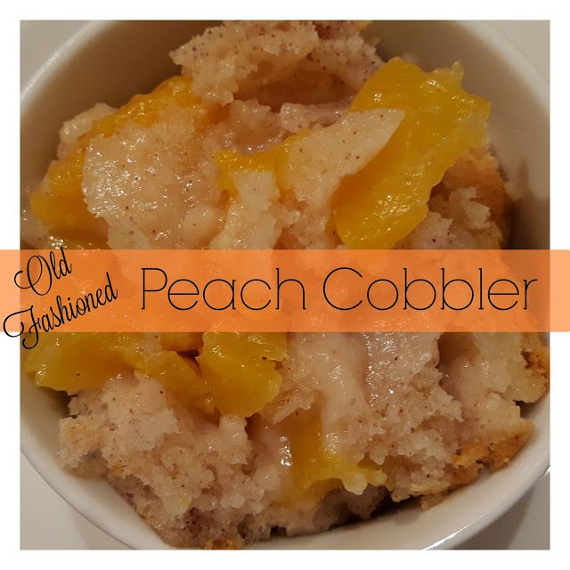 peach cobbler in a white bowl with an orange border