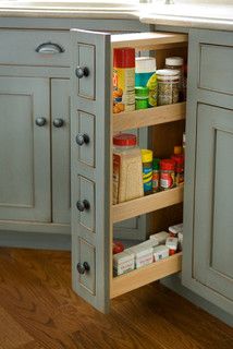 two pictures of the inside of an open cabinet in a kitchen, one with drawers and the other without doors