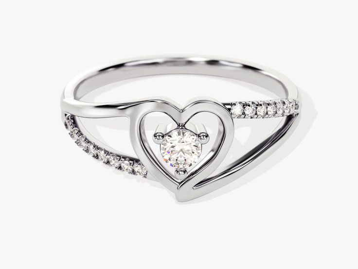 Make a statement with this classic Split Shank Diamond Heart Ring. Crafted with 0.18 ct of diamonds and set in 14K solid gold, this piece of jewelry makes a beautiful and romantic gift. Enjoy the timeless design and dazzle your loved one with its elegant sparkle. DETAILS: --Size Range: 2 US - 11 US--Weight (in 14k Gold): ~ 1.74 grams for Size 6.5 (Depends on the size)--Gold Kt Options: 14k and 18k--Color Options: Yellow Gold, Rose Gold and White Gold--Gemstone: Diamond--Diamond Cut: Round--Numbe Diamond Heart Ring, Split Shank, Romantic Gift, Diamond Sizes, Diamond Heart, Diamond Cut, Gold Rose, Colored Diamonds, Heart Ring